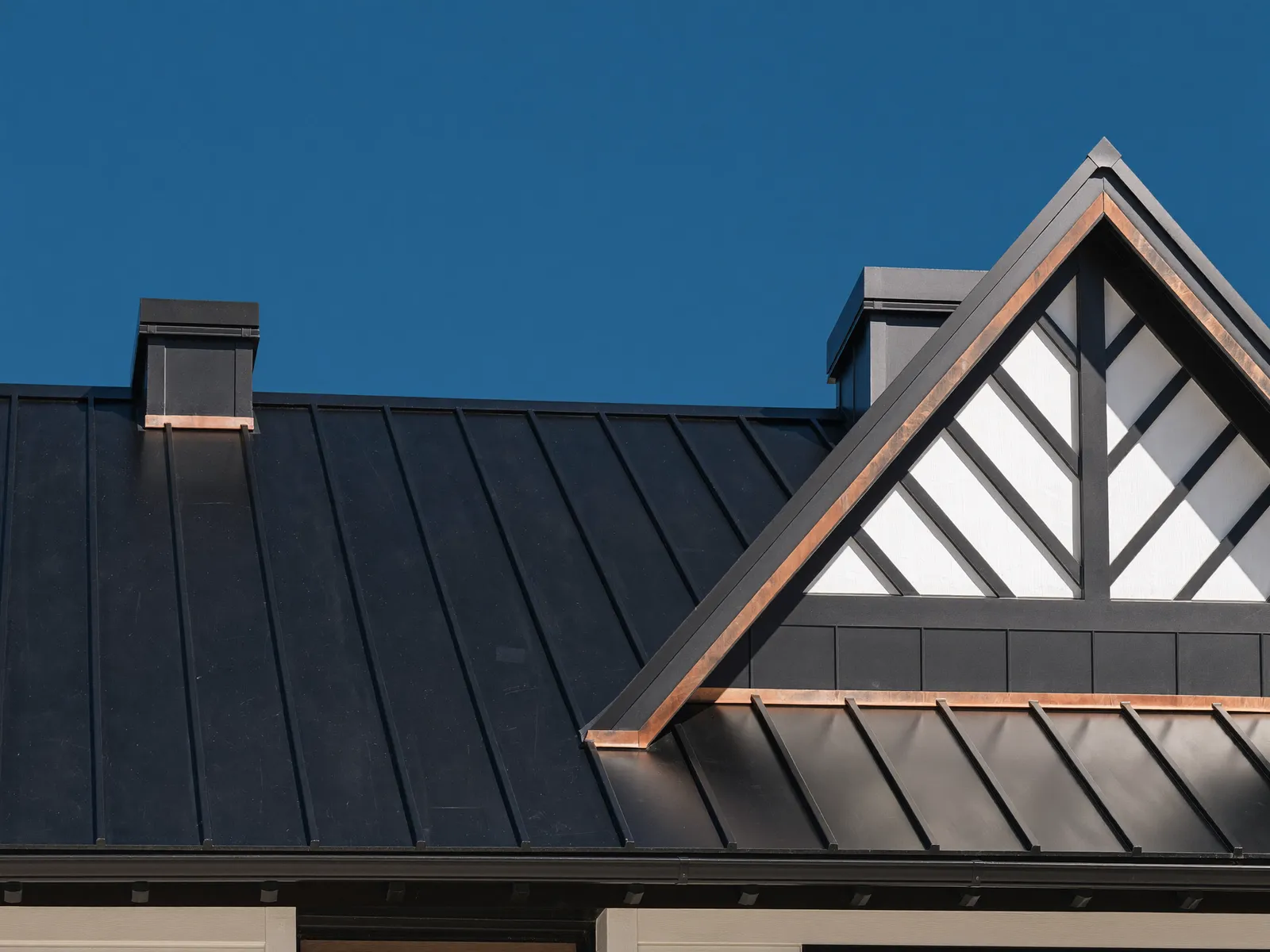 Standing-seam metal roof detail on a modern-farmhouse custom home